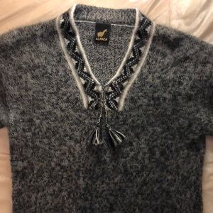 Soft Alpaca wool sweater with fringe at the ends,
